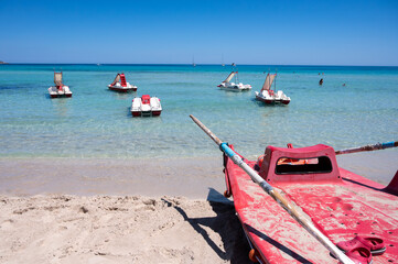 Sunny day on seaside vacation destination, Mondello Beach, near Palermo in Sicily with fine, golden...
