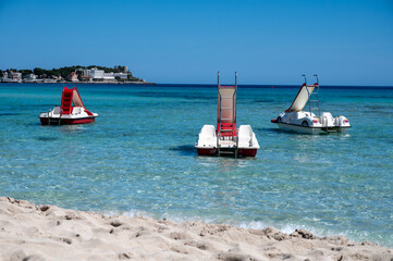 Sunny day on seaside vacation destination, Mondello Beach, near Palermo in Sicily with fine, golden...