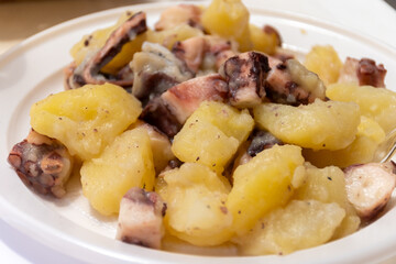 Tasty antipasti salad or starter seafood dish, grilled octopus sicilian style with potatoes served on fish market in Marsala, Sicily, street food in Italy