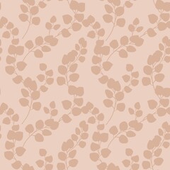 Seamless pattern with eucalyptus branches on a brown background. Ideal for textiles, packaging, wallpaper, printing and digital design.