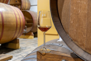 Visit of wine cellar with old large oak barrels, glass of fortified dry or sweet tasty marsala wine...
