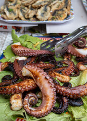Catch of the day, fresh tasty seafood, grilled octopus sicilian style on fish marken in Palermo,...