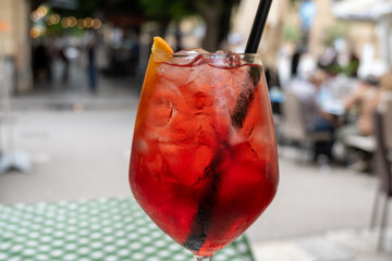 Spritz Campari red bitter long drink cocktail maid with liqueur, prosecco sparkling wine, ice cubes...