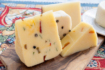 Italian provolone cheese made with fresh rocket salad, black pepper, olives, wine, Sicilian cheese, Palermo food, Sicily