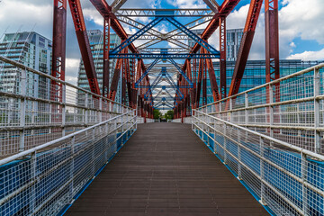 Naklejka premium A view up the ramp leading onto the Detroit Bridge in Salford Quays, Manchester,UK in summertime