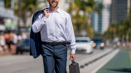 Corporate business. Rich businessman in suit. Business portrait. Successful businessman walking...