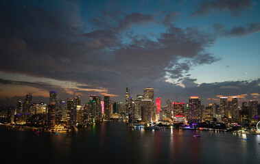 Aerial night view of Brickell skyline in downtown Miami. Skyscrapers above Miami. Scenic panorama...