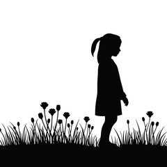 Girl silhouette standing among flowers in a grassy field  