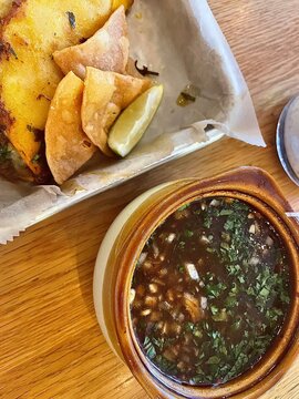 quesabirria tacos with chips and consome 