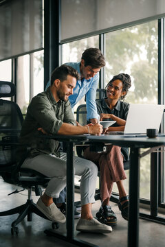 Group of busy happy diverse professional business team people working in office using digital tablet