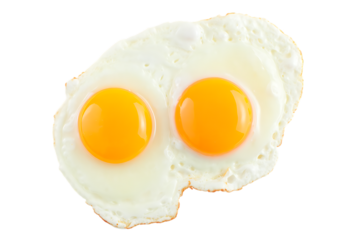 Two perfectly fried eggs with bright yellow yolks isolated on transparent background