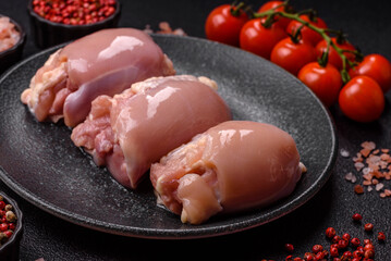 Raw chicken thigh fillet without skin and bone with salt and spices. Raw chicken fillet for cooking