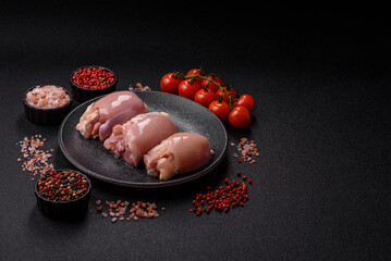 Raw chicken thigh fillet without skin and bone with salt and spices. Raw chicken fillet for cooking