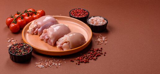 Raw chicken thigh fillet without skin and bone with salt and spices. Raw chicken fillet for cooking