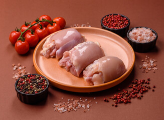 Raw chicken thigh fillet without skin and bone with salt and spices. Raw chicken fillet for cooking