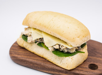 Chicken Mozzarella & Mushroom Panini with Fresh Spinach on wooden bard side view of lunch menus on white background