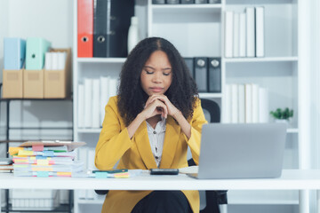 Task of Deep Reflection: A woman with a serious and concentrated expression, absorbed in thought at her desk. Focus on problem-solving, stress, or making a tough decision.