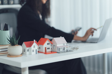 Property Dreams: A detailed desktop perspective unveils a real estate professional's world,...