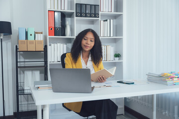 Focus and Dedication in the Workplace: A focused professional is engrossed in her task, with a...