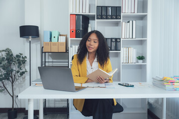 Office Daydream: A focused individual sits at their desk, immersed in a book while surrounded by...