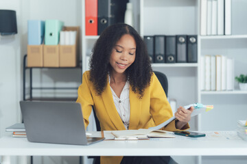 Focused Professional: A dedicated professional woman, immersed in her workspace, engaged in...
