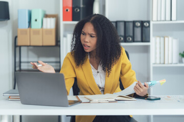 Serious, laptop and thinking with black woman in office for research, project browsing and...