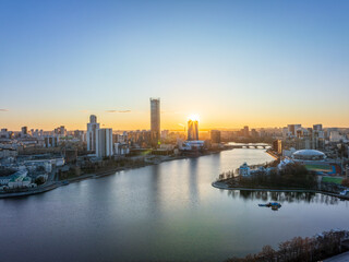Yekaterinburg aerial panoramic view in spring at sunset. Yekaterinburg city and pond in spring or autumn.