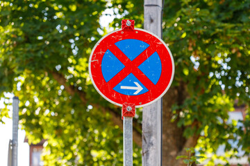 German No Parking Sign with Right Arrow on Metal Pole