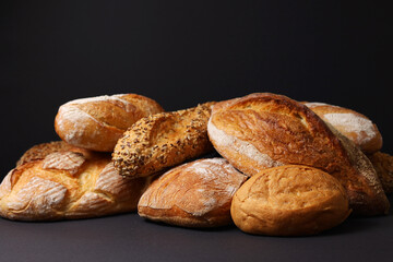 Freshly Baked Artisan Bread displayed on a dark background, highlighting its craftsmanship
