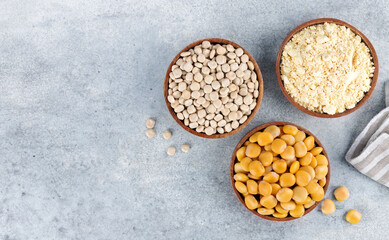 Gluten free lupine flour, dry lupine beans, protein rich snack of pickled lupine beans on gray background. Top view.