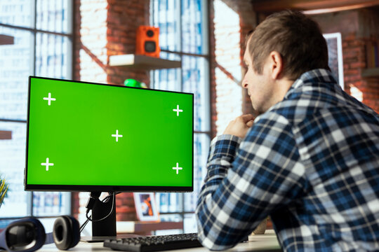 Employee completing spreadsheets on chroma key computer, entering numerical data into cells, calculating totals. Man analyzing figures on isolated screen PC monitor, using spreadsheet software