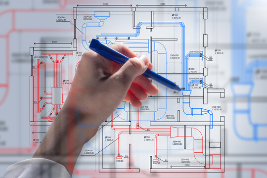 Drawings of ventilation system. Scheme of vents communications at hand. Drawings of air handling unit. Plan of air-conditioning ducts. Designer draws industrial utilities. Design of ventilation