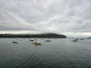 boats on the lake in a misty day