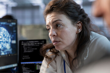 Programmer doing data center workplace automation using AI and machine learning tools. IT worker...