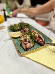 Baked squid stuffed with onions, carrots and mushrooms