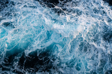 Sea water splash with foamy wave. Water surface texture. Tropical islands ferry travel. Cruiseliner...