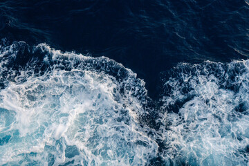 Sea water splash with foamy wave. Water surface texture. Tropical islands ferry travel. Cruiseliner...