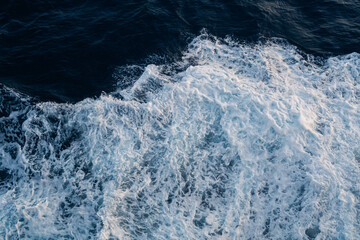 Sea water splash with foamy wave. Water surface texture. Tropical islands ferry travel. Cruiseliner...