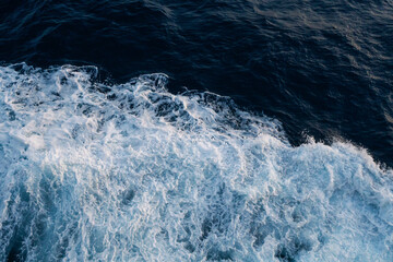 Sea water splash with foamy wave. Water surface texture. Tropical islands ferry travel. Cruiseliner...