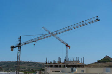 New building construction site work with tower cranes