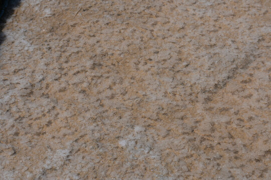 Salt pans and a rocky mountain near Zebbug town at Gozo island, Malta