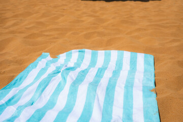 beach towels on an orange sand, sandy seashore beach