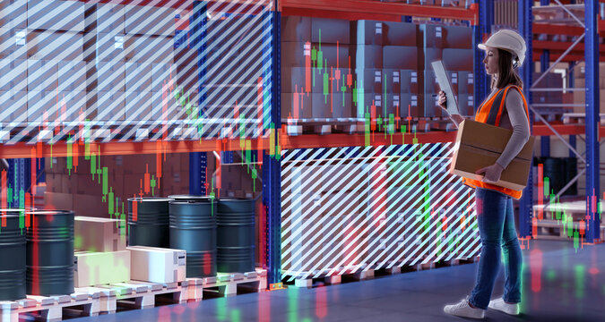 Female warehouse manager analyzing inventory data, holding box and clipboard, stock market graphs, digital logistics concept – Warehouse.