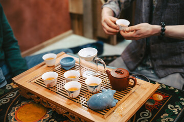 Hands Holding Tea Cup During Traditional Ceremony