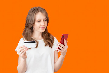 Woman Paying With Credit Card Using Smartphone