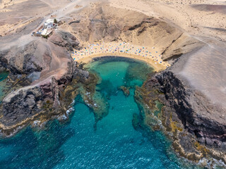 Sandy beach Playa de Papagayo aerial view from drone, Lanzarote