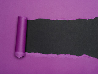 Purple Paper Tear Reveals Black Background
