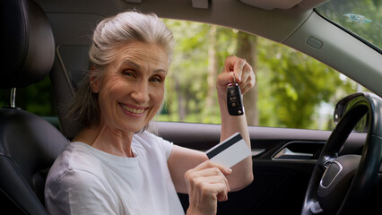 Happy joyful Caucasian smiling elderly senior woman female mature car automobile driver vehicle...