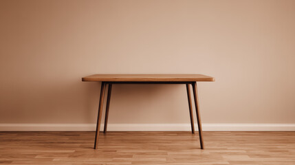 A minimalist wooden table stands against a plain beige wall on a polished hardwood floor, showcasing simple mid-century modern design.
