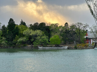 Lakeside Pavilion under Golden Storm Clouds